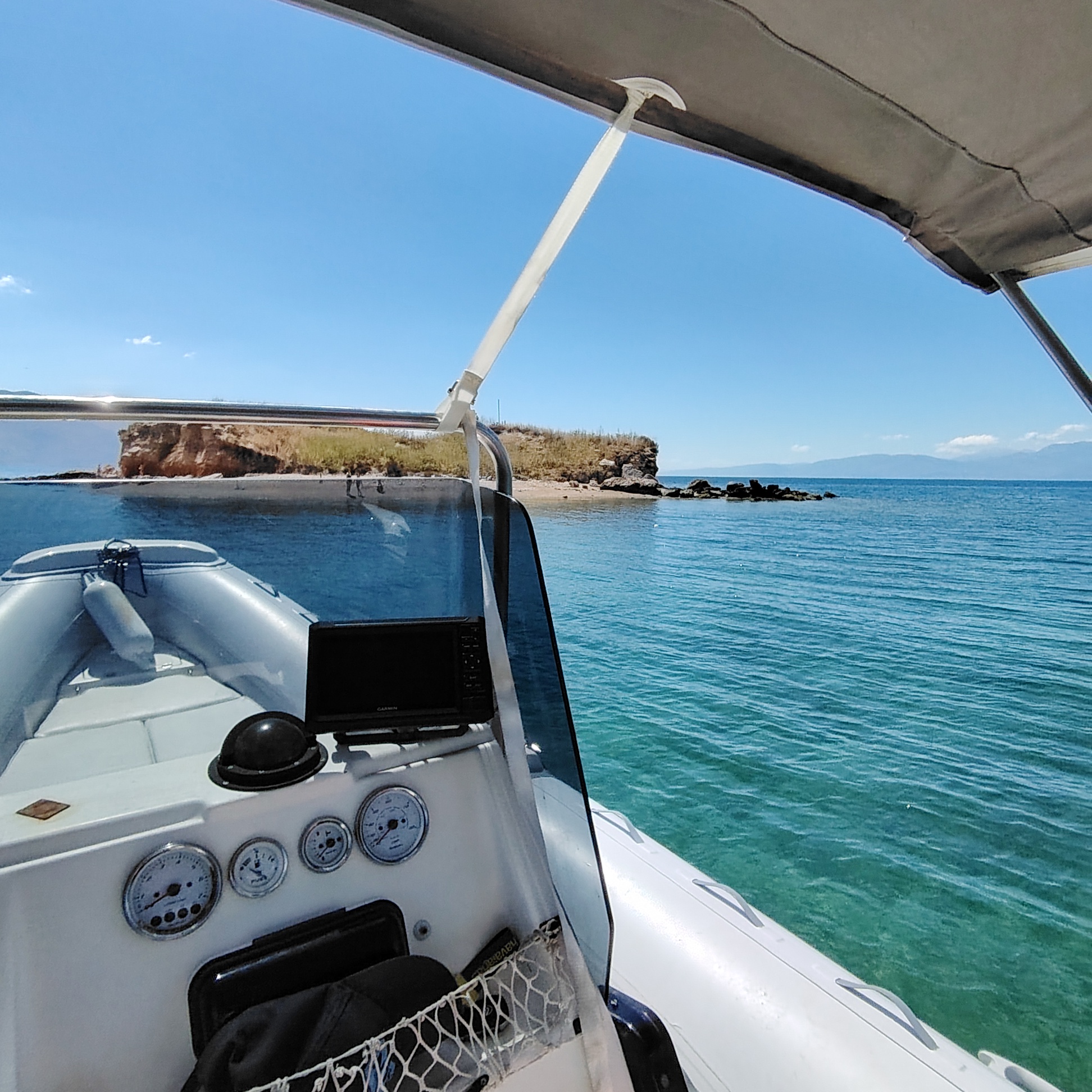 View from the helm approaching a small island