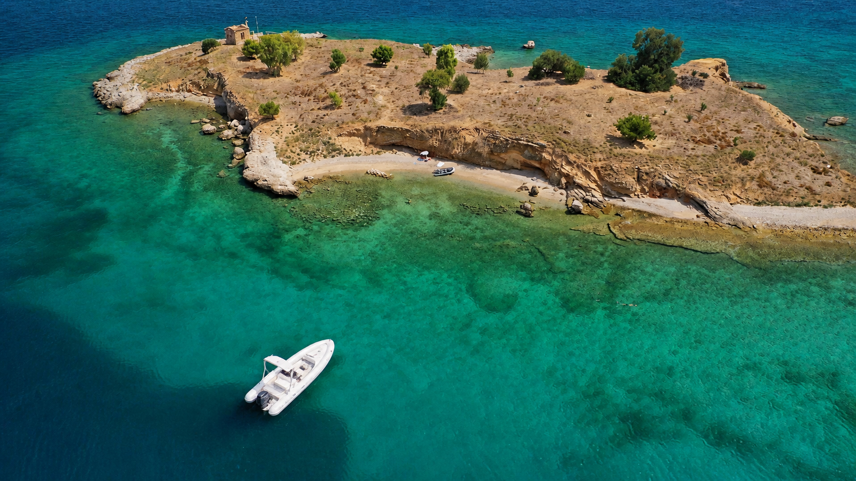 Aerial view of a small island and RIB in the turquoise Gulf of Corinth